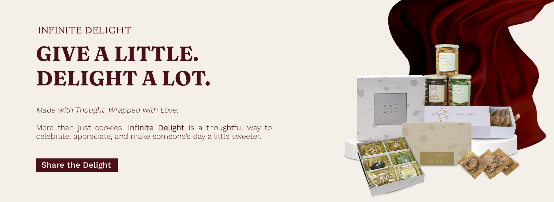 Give a little, delight a lot — Infinite Delight gift boxes with red silk backdrop